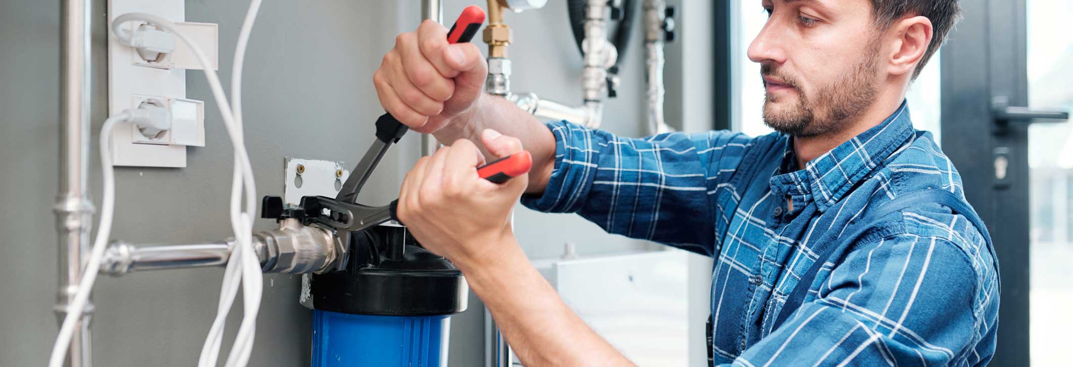 Technician servicing a water filtration system